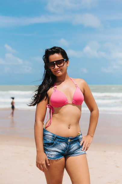 Portrait of young woman wearing a short and bikini on the tropic - Φωτογραφία, εικόνα