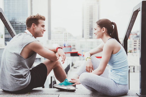 Happy athletic couple spending time together after workout. - Photo, image