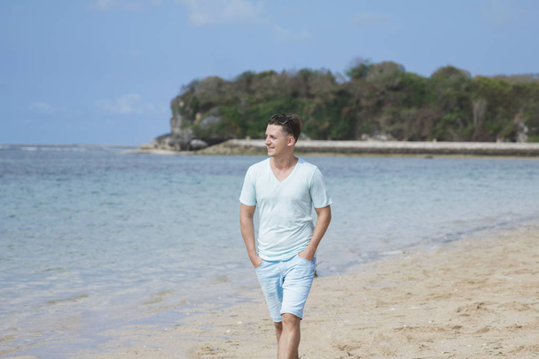 young man walking at beach  - Fotó, kép