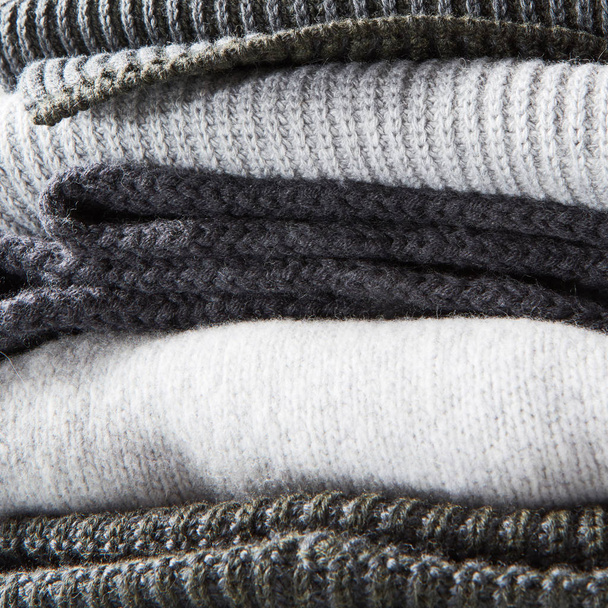 stack of warm winter knitted sweaters - Foto, Bild