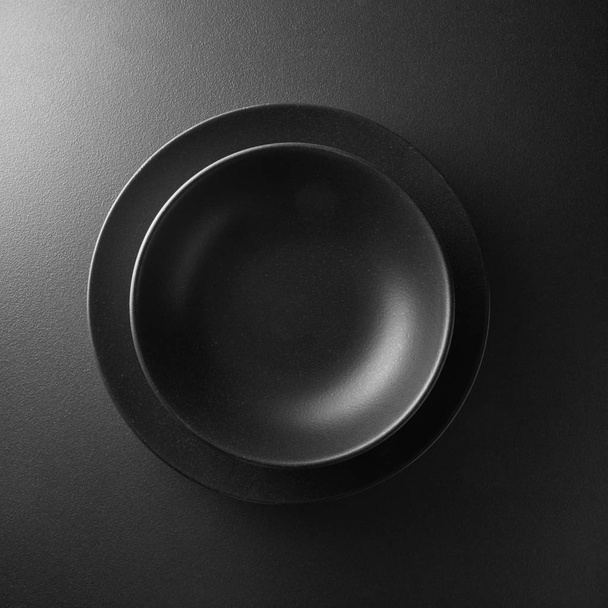 black plate on a  background - Foto, Imagem