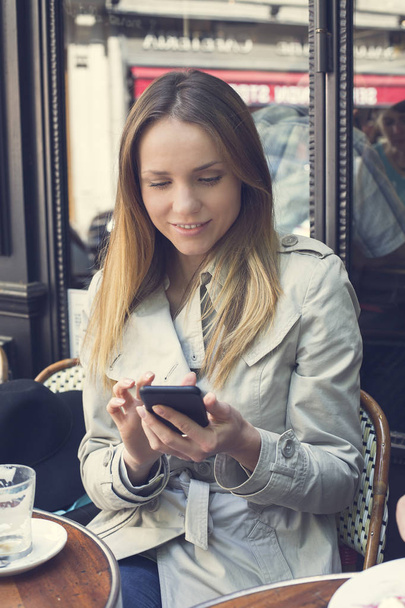 Woman using a smartphone - Photo, Image