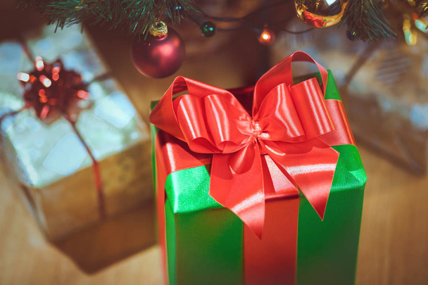 Wrapped Christmas presents under a Christmas tree - Φωτογραφία, εικόνα