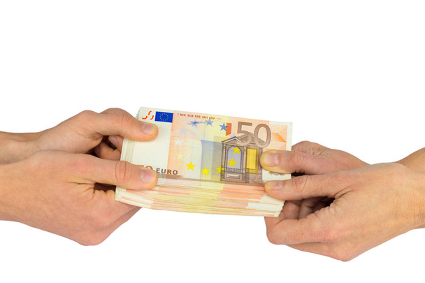 Handen trekken aan vijftig euro notities - Foto, afbeelding