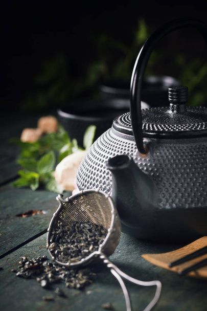 Japanese teapot and cups with mint tea - Fotoğraf, Görsel