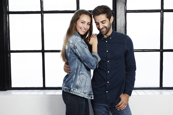 Smiling loving couple in denim clothes - Foto, afbeelding