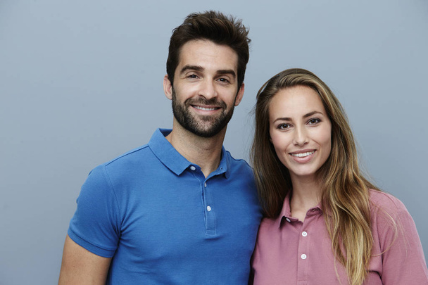 Smiling couple in polo shirts - Zdjęcie, obraz