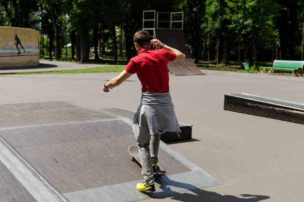 Young man with skateboard - Фото, изображение