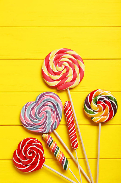Sweet lollipops on  table - Фото, изображение