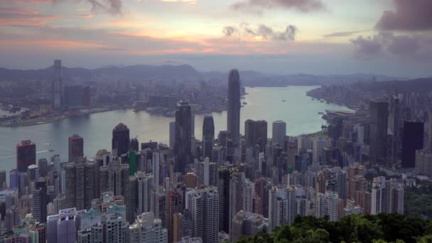 Sunrise over the city skyline and Victoria Harbour viewed from Victoria Peak - Footage, Video