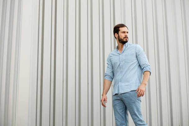 Handsome young man with beard on gray background - Zdjęcie, obraz