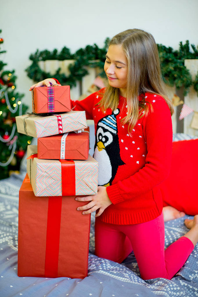 happy child girl with Christmas gifts - Фото, изображение