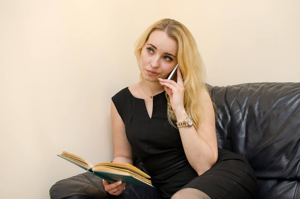 Young woman reading a book - Fotó, kép