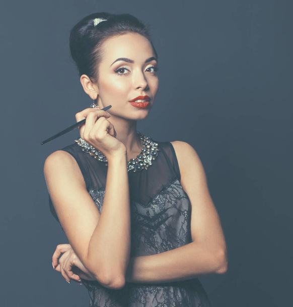 Portrait of young beautiful woman with jewelry - Foto, Imagen
