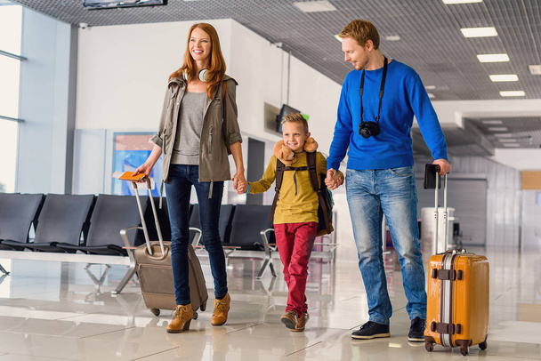 Happy family with suitcases in airport - Foto, Imagem