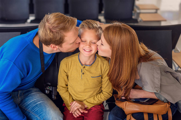 Happy family hugging at airport - Fotografie, Obrázek