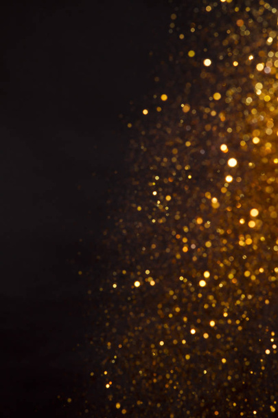 Background of Golden lights with bokeh effect - Foto, imagen