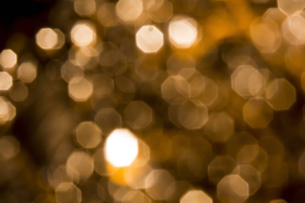 Background of Golden lights with bokeh effect - Foto, afbeelding
