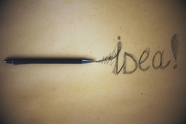 Aged paper sheet with pen and idea writing. Idea concept - Foto, immagini