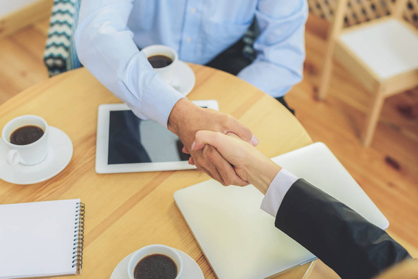 Handshake after successful business deal - Foto, afbeelding