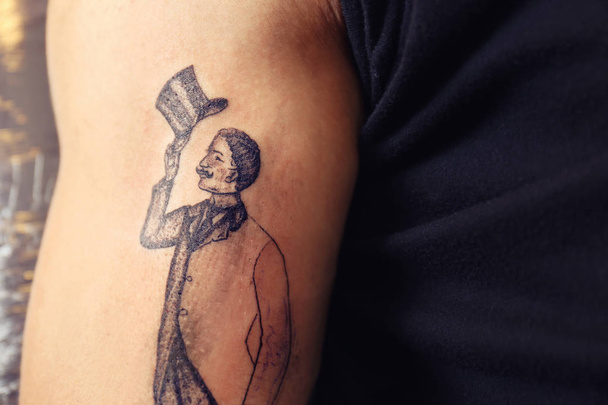 Male arm with unfinished tattoo, close up view - Valokuva, kuva
