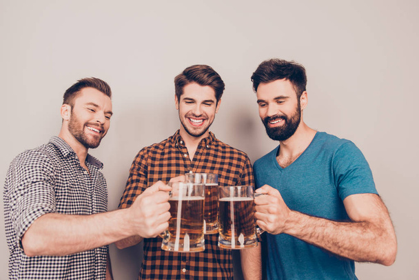 Cheers ! Three cheerful young men with glasses of beer - Фото, зображення