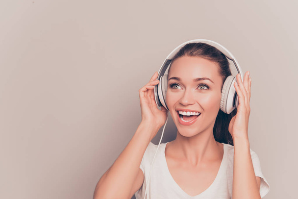 Portrait of happy music lover listening music and singing - Foto, Imagen