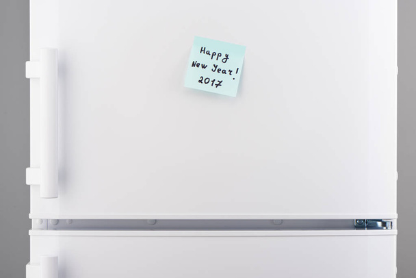 Happy New Year 2017 note on white refrigerator door - Photo, image