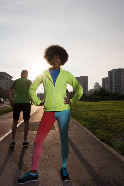 sporty young african american woman running outdoors - Foto, imagen