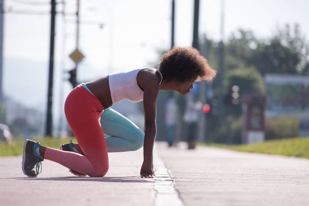 sporty young african american woman stretching  - Foto, Imagem