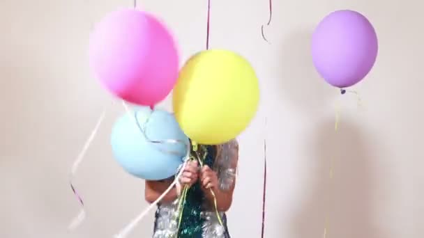 woman jumping with balloons - Filmagem, Vídeo