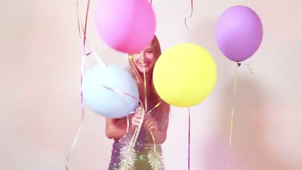 woman jumping with balloons - Video