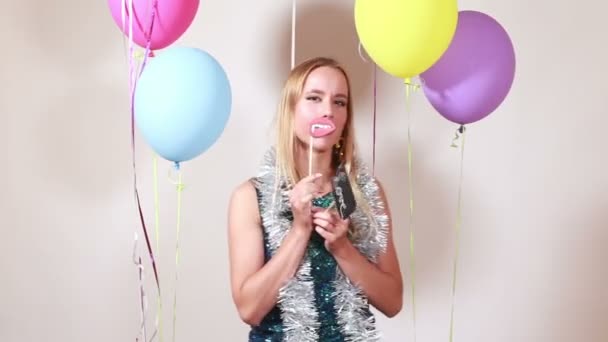woman having fun in party photo booth - Materiał filmowy, wideo