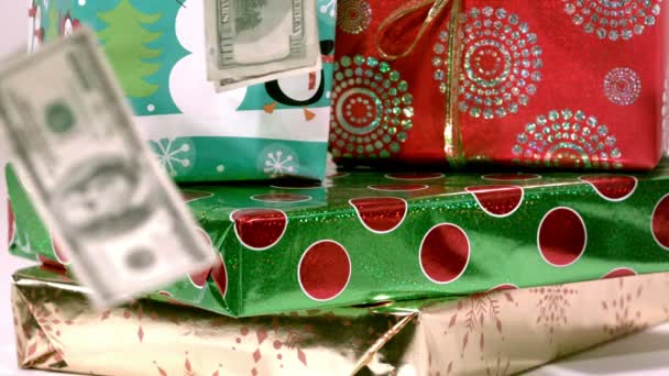 slow motion cash falling on christmas gifts - Footage, Video