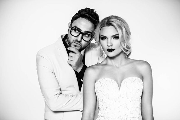 young fashion couple on a white background in studio - Φωτογραφία, εικόνα