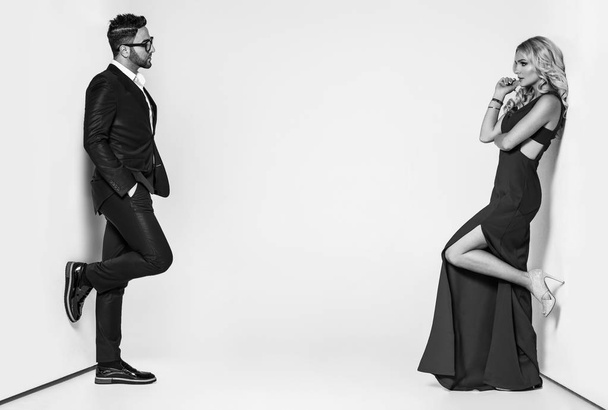 young fashion couple on a white background in studio - Fotoğraf, Görsel
