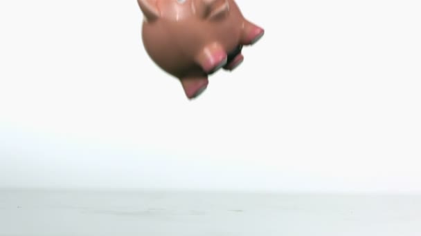 slow motion dropping and breaking piggy bank - Footage, Video