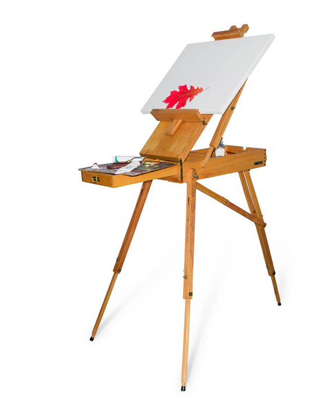 cavalete de madeira com tela vazia em um fundo claro
 - Foto, Imagem