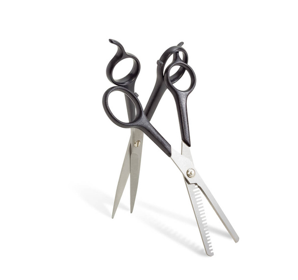 Two different hairdressers scissors on a light background - Photo, Image