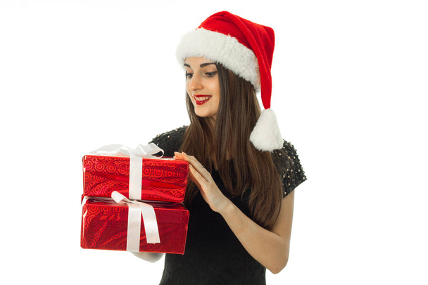 Gorgeous girl in santa hat with red gift box - Fotoğraf, Görsel