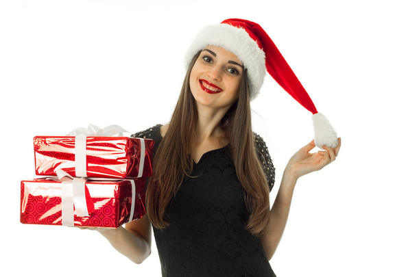 Charming girl in santa hat with red gift box - Fotó, kép