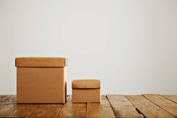 Mockups of blank brown corrugated cardboard boxes - Фото, изображение