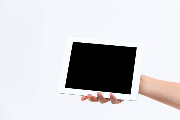 Human hand holding tablet - Foto, afbeelding