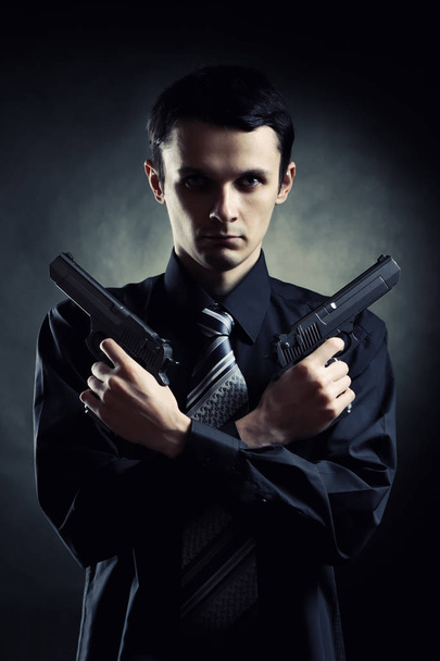 Killer with two pistols - Fotó, kép