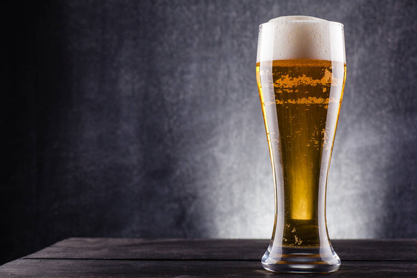 Tall glass of beer - Фото, изображение