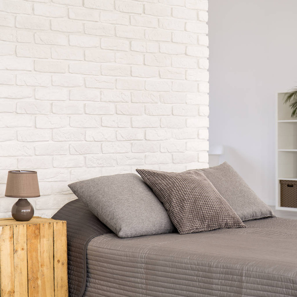 Brick wall in modern bedroom - 写真・画像