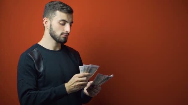 Beard Man in Black Counts Dollars Banknotes - Materiał filmowy, wideo