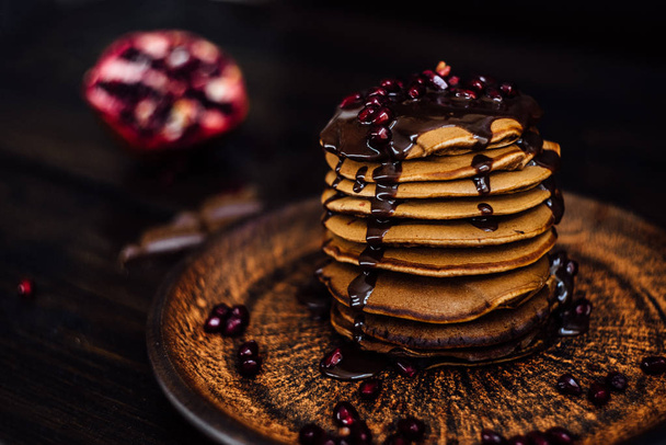 warm pancakes with pomegranate seeds - Photo, Image