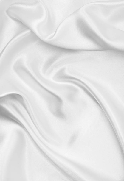Smooth elegant white silk or satin luxury cloth texture as weddi - Foto, afbeelding