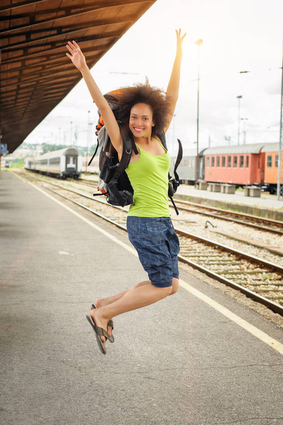 Happy female tourist jumping - Fotoğraf, Görsel